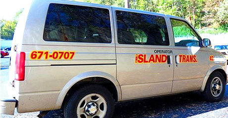 Mid Island Taxi Corp's Gray van